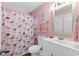 Pink bathroom includes a flamingo themed shower curtain and a vanity at 222 Landing Rd. # 1811, North Myrtle Beach, SC 29582