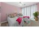 Comfortable twin bedroom with pink walls and a decorative flamingo theme at 222 Landing Rd. # 1811, North Myrtle Beach, SC 29582