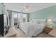 Bright bedroom with a ceiling fan, a window, a bed, and a nightstand at 222 Landing Rd. # 1811, North Myrtle Beach, SC 29582