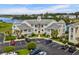 A beautiful condominium complex with manicured landscaping, ample parking, and waterfront views under a sunny sky at 222 Landing Rd. # 1811, North Myrtle Beach, SC 29582