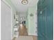 Bright entryway with hardwood floors, mint green walls, decorative mirror, and modern lighting fixture at 222 Landing Rd. # 1811, North Myrtle Beach, SC 29582