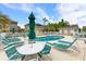 Inviting pool area with lounge chairs, tables, and shaded umbrellas at 222 Landing Rd. # 1811, North Myrtle Beach, SC 29582