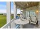 Inviting outdoor porch with blue seating, bright decor, and scenic views of the surrounding landscape at 222 Landing Rd. # 1811, North Myrtle Beach, SC 29582