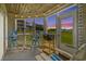 Relaxing screened porch with scenic views and charming blue and white accents at 222 Landing Rd. # 1811, North Myrtle Beach, SC 29582