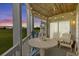 Relaxing screened-in porch with seating, wood ceiling, scenic views, and decorative beach accents at 222 Landing Rd. # 1811, North Myrtle Beach, SC 29582
