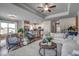 Open-concept living area with modern decor, seamlessly connecting the living, dining and kitchen at 227 Sundrop Way, Conway, SC 29526