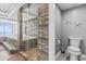 Bathroom boasting a luxurious shower with stone tile, glass door, a soaking tub and toilet room at 2500 N Ocean Blvd. # Ph 1, Myrtle Beach, SC 29577