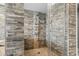 Modern shower design featuring stone tile, glass doors, and a multi-setting shower head at 2500 N Ocean Blvd. # Ph 1, Myrtle Beach, SC 29577
