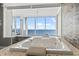 Relaxing bathroom featuring a luxurious soaking tub and stunning ocean view through a large window at 2500 N Ocean Blvd. # Ph 1, Myrtle Beach, SC 29577