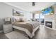 Comfortable bedroom with balcony access, fireplace, flatscreen television, and stylish decor at 2500 N Ocean Blvd. # Ph 1, Myrtle Beach, SC 29577