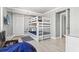 bedroom features a bunkbed, storage, and a flatscreen television for entertainment at 2500 N Ocean Blvd. # Ph 1, Myrtle Beach, SC 29577