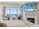 Inviting bedroom with a balcony offering stunning ocean views, a fireplace, and a flatscreen television at 2500 N Ocean Blvd. # Ph 1, Myrtle Beach, SC 29577