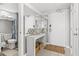 Light-filled entryway with console table, mirror, and easy access to bathroom at 2500 N Ocean Blvd. # Ph 1, Myrtle Beach, SC 29577