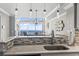 Close-up of the kitchen's countertop, sink, and the stunning ocean view from the dining area at 2500 N Ocean Blvd. # Ph 1, Myrtle Beach, SC 29577