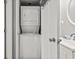 Convenient laundry closet with stacked washer and dryer combo, and a sink at 2500 N Ocean Blvd. # Ph 1, Myrtle Beach, SC 29577
