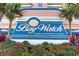 The Bay Watch Resort and Conference Center sign with floral landscaping at 2801 S Ocean Blvd. # 535, North Myrtle Beach, SC 29582