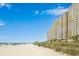 View of the beachfront resort from the beach showcasing easy access and many private balconies at 2801 S Ocean Blvd. # 535, North Myrtle Beach, SC 29582