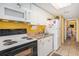 Efficient kitchen with white cabinets, range, microwave, sink, and refrigerator at 2801 S Ocean Blvd. # 535, North Myrtle Beach, SC 29582