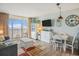 Cozy living room with balcony access, bright décor, and comfortable seating at 2801 S Ocean Blvd. # 535, North Myrtle Beach, SC 29582
