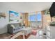 Inviting living area with ocean views from the balcony, complemented by beachy decor and furnishings at 2801 S Ocean Blvd. # 535, North Myrtle Beach, SC 29582