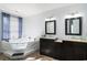 Bathroom featuring a large jetted tub, double sink vanities, and elegant decor, offering comfort at 2981 Victor Rd., Longs, SC 29568