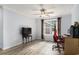 Bright bedroom featuring wood floors, neutral paint, ceiling fan and a large window at 2981 Victor Rd., Longs, SC 29568