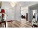 Inviting foyer boasts stylish wood floors and a stunning chandelier at 2981 Victor Rd., Longs, SC 29568