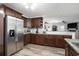 Spacious kitchen with stainless steel appliances, ample counter space, and dark wood cabinetry at 2981 Victor Rd., Longs, SC 29568