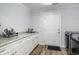 Functional laundry room with modern appliances, ample counter space, and convenient access to the backyard at 2981 Victor Rd., Longs, SC 29568