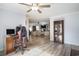 Open-concept living room featuring wood floors, and a view into a Gathering area at 2981 Victor Rd., Longs, SC 29568