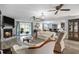Spacious living room showcasing wood floors, a fireplace, and elegant furnishings at 2981 Victor Rd., Longs, SC 29568