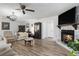 Comfortable living room area with wood floors, a fireplace, and neutral decor at 2981 Victor Rd., Longs, SC 29568