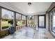 Enclosed sunroom featuring large windows and outdoor views, blending indoor comfort with nature's beauty at 2981 Victor Rd., Longs, SC 29568