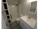 Bathroom featuring a walk-in shower, shelving, and vanity with a sink and a mirror at 300 47Th Ave. S # 1F, North Myrtle Beach, SC 29582