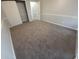 Bedroom featuring neutral colored carpet, painted walls, and a closet with sliding doors at 300 47Th Ave. S # 1F, North Myrtle Beach, SC 29582