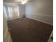Bedroom with a large window, textured carpet, and a ceiling fan at 300 47Th Ave. S # 1F, North Myrtle Beach, SC 29582