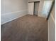 Bedroom featuring neutral colored carpet, painted walls, and a closet with sliding doors at 300 47Th Ave. S # 1F, North Myrtle Beach, SC 29582