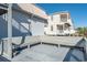 Exterior image featuring a deck with wood railings, seating, and a view of nearby homes at 300 47Th Ave. S # 1F, North Myrtle Beach, SC 29582