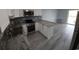 Modern kitchen with stainless steel appliances, granite countertops, and neutral-toned backsplash at 300 47Th Ave. S # 1F, North Myrtle Beach, SC 29582