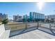 Deck view of nearby condos and ocean against a bright blue sky at 300 47Th Ave. S # 1F, North Myrtle Beach, SC 29582