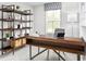 Home office with desk, shelving, natural light, creating a perfect workspace at 3210 Nw Edgemead Circle # C, Calabash, NC 28467