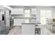 Stylish kitchen with granite counters, stainless appliances, and an island flowing into the dining area at 3210 Nw Edgemead Circle # C, Calabash, NC 28467