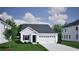 Charming single-story home with a symmetrical facade, attached two-car garage, and well-maintained lawn at 3432 Logan St., Conway, SC 29526