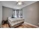 Comfortable bedroom with hardwood floors, a full-sized bed and natural lighting at 403 Chesterfield Ct., Myrtle Beach, SC 29577