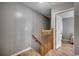 Hallway featuring an ornate banister with access to an open doorway leading to a bedroom at 403 Chesterfield Ct., Myrtle Beach, SC 29577