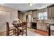 Eat-in kitchen with stainless steel appliances, granite countertops, and stylish tile backsplash at 403 Chesterfield Ct., Myrtle Beach, SC 29577