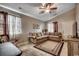 Comfortable living room offering a large sectional sofa, tile flooring and natural light at 403 Chesterfield Ct., Myrtle Beach, SC 29577