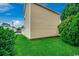 A lush green lawn, mature shrubs, and well-maintained siding define this inviting side yard at 403 Chesterfield Ct., Myrtle Beach, SC 29577