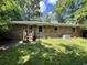 Spacious backyard showcasing a brick home with a grass lawn at 41 Harmon St., Hemingway, SC 29554