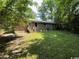 Spacious backyard featuring a brick home with stairs to the back entrance at 41 Harmon St., Hemingway, SC 29554